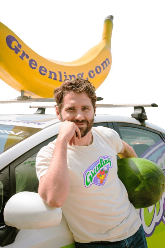 Mason Arnold with the Greenling delivery car